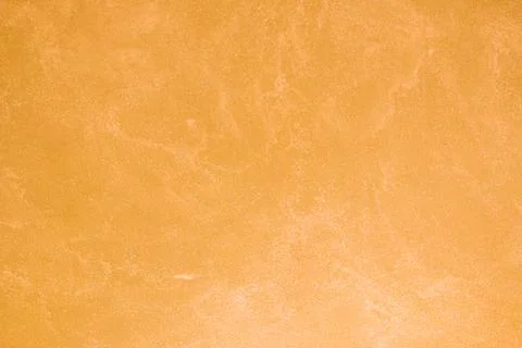 Texture of old orange plaster damaged by weather. Stock Photos