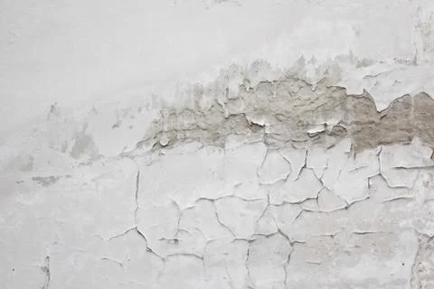 Texture of old peeling gray wall covered with plaster closeup. time breaking  Stock Photos