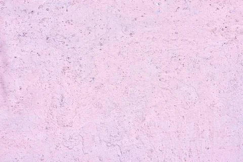 The texture of an old pink plaster wall. Close-up, pattern. Stock Photos