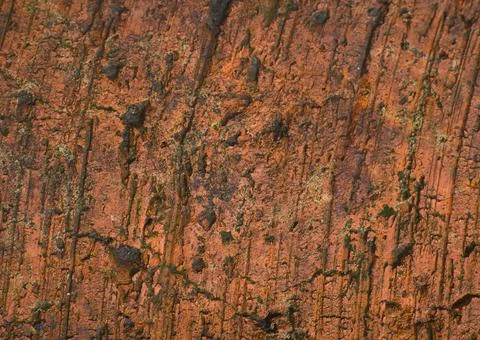 The texture of an old red brick. Closeup. Dimmed lights Stock Photos