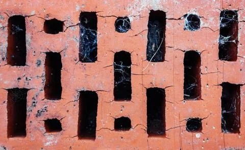 Texture of old red brick with many cracks and cobweb, top view. Fotos Stock
