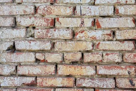 The texture of an old red brick wall. Close-up, pattern. Stock Photos
