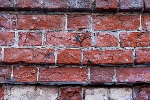 The texture of an old  red brick wall. Close-up, pattern. Stock Photos