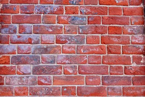 The texture of an old  red brick wall. Close-up, pattern. Stock Photos