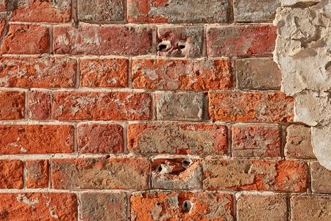 The texture of an old red  brick wall. Close-up, pattern. Stock Photos