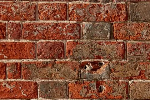 The texture of an old red  brick wall. Close-up, pattern. Stock Photos