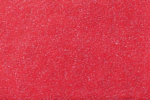 Texture of old red paper background, closeup. Structure of dense carmine card Stock Photos