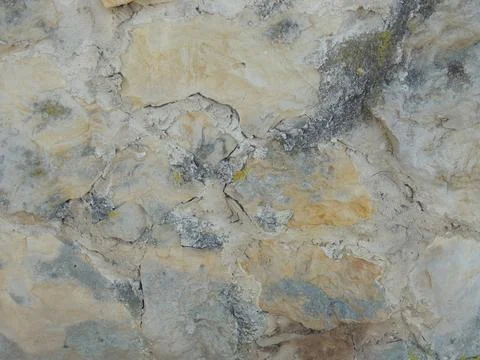 Texture of old relief limestone stone wall Stock Photos