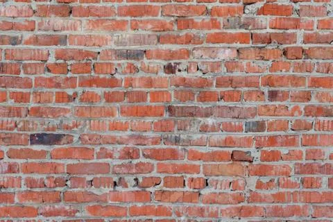 The texture of the old relief wall of red brick Stock Photos