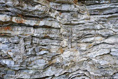 Texture old rock wall made of random stone background. Stock Photos