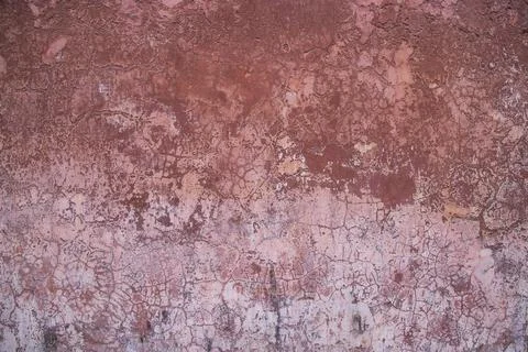 The texture of an old rustic wall is covered with pink stucco Stock Photos
