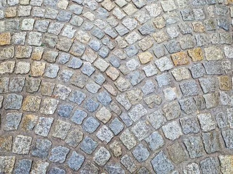 Texture old stone blocks in gray in the city. road paved with granite stones Foto stock