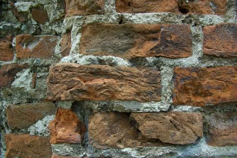 The texture of the old stone brickwork is a fragment of an old rough brick wa 写真素材