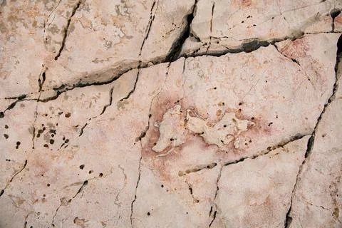 Texture of old stone with cracks on the surface. 스톡 사진