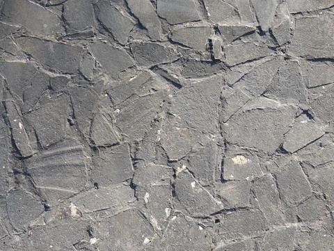 Texture of old stone paving made of gray broken flagstone Stock Photos