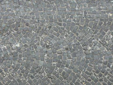 Texture of an old stone road, top view. Stock Photos
