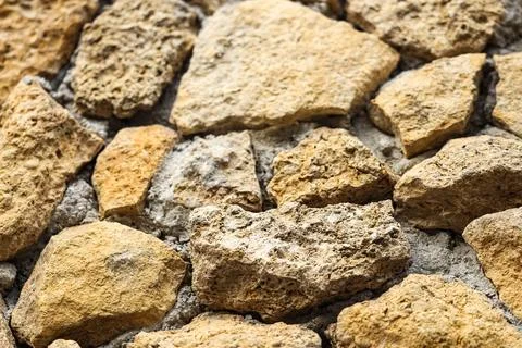 Texture of old stone wall as background, closeup Stock Photos
