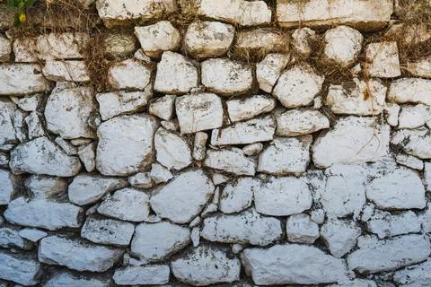 Texture of old stone wall made from limestone Stock Photos