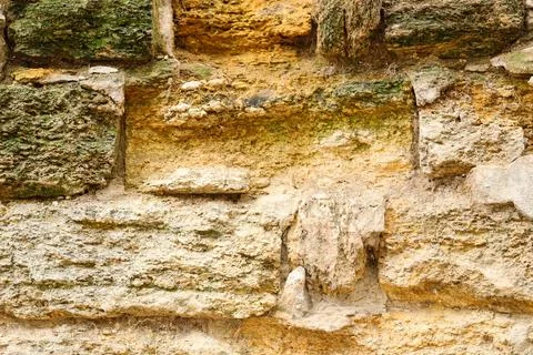 Texture of old stone wall with moss as background Stock Photos