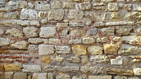 Texture of old stone weathered wall Stock Photos