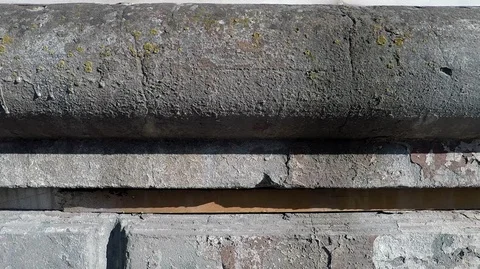 Texture  of the old wall of the building, the camera moves from top to bottom Stock Footage 128291791