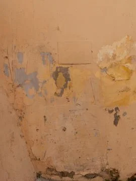 Texture of old wall covered with yellow stucco Stock Photos