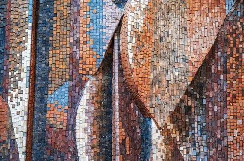 Texture of old wall decorated with colorful mosaics close up Stock Photos