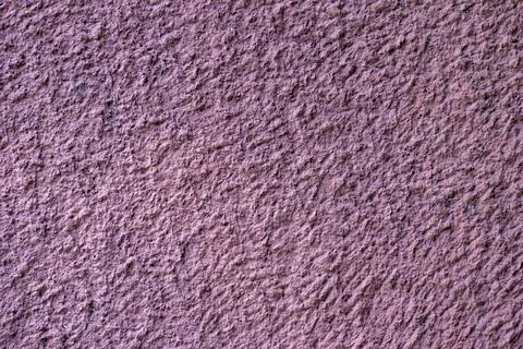 Texture of old wall with decorative plaster dark purple colors. . Stock Photos
