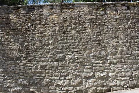 Texture of old wall made of stones Stock Photos