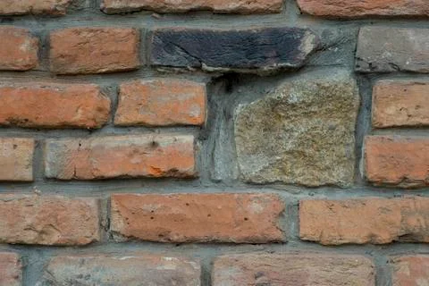 The texture of the old wall from the red bricks as background. Stock Photos