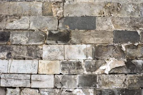The texture of the old wall of stone blocks Stock Photos