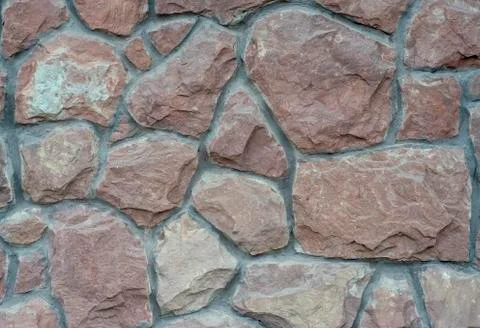 The texture of the old wall from stones as background Stock Photos