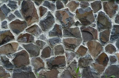 The texture of the old wall from stones as background Stock Photos