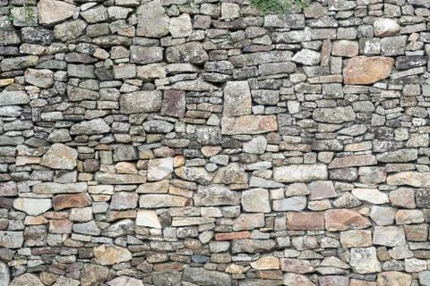 Texture of old weathered medieval stone wall Stock Photos