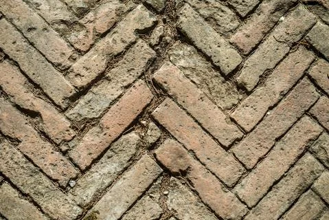 Texture of old weathered red brick sidewalk. Stock Photos