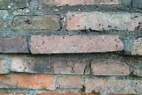 Texture of an old weathered red brick wall. Fotos de archivo