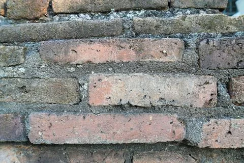 Texture of an old weathered red brick wall. 스톡 사진