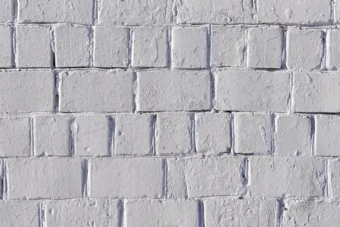 The texture of an old white brick wall. Close-up, pattern. Stock Photos