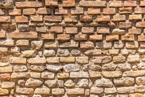 Texture of old worn brick wall with orange color Stock Photos