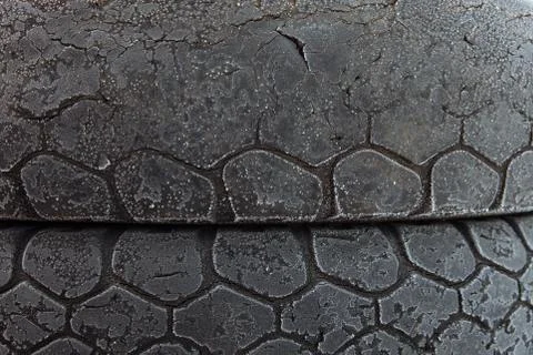 The texture of the old worn tires for the car. Stock Photos