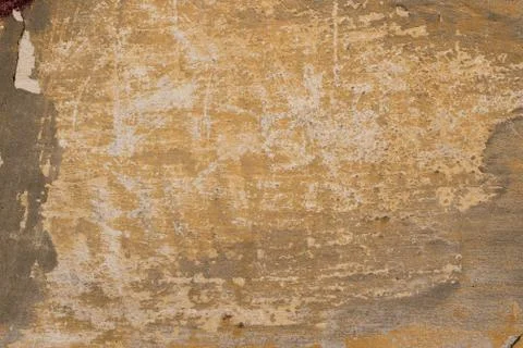 Texture of an old yellow wall. Stock Photos