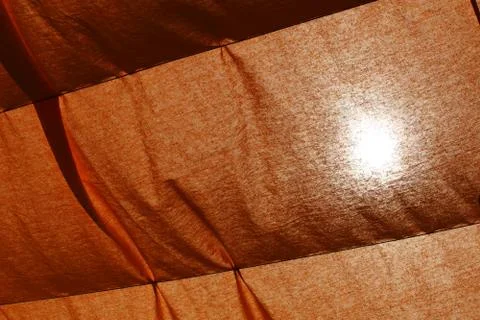 Texture of a open beach umbrella with translucent rays Stock Photos