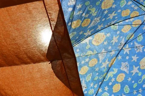 Texture of a open beach umbrella with translucent rays Stock Photos
