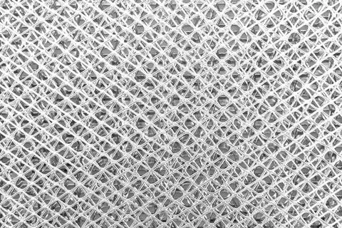 Texture or background of metal mesh with holes. Metal Stock Photos