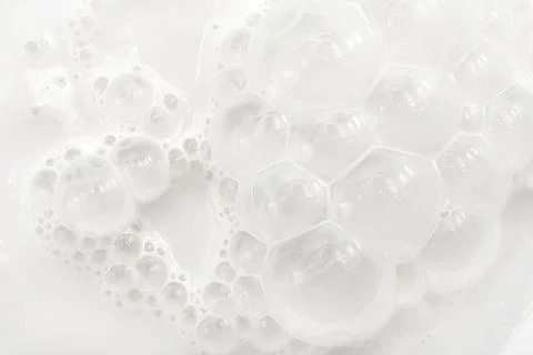 Texture or background from milk with bubbles close up. Milk Stock Photos