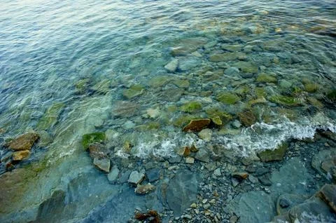 The texture or pattern of the stones under water.Rocky, rocky seashore Foto stock