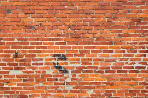 Texture of orange and red brick wall 스톡 사진