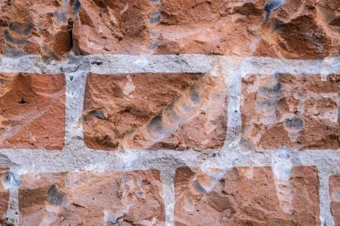 The texture of an orange brick old wall. Stock Photos