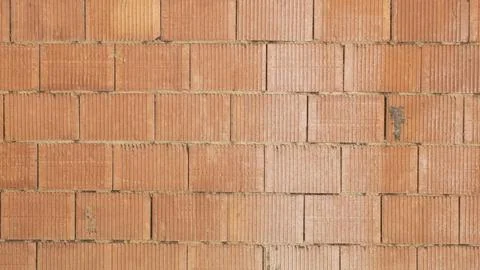 Texture of an orange-coloured brick wall Stock Photos