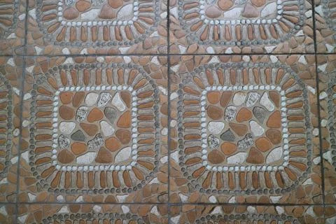 The texture of the orange embossed floor in front of the house 스톡 사진